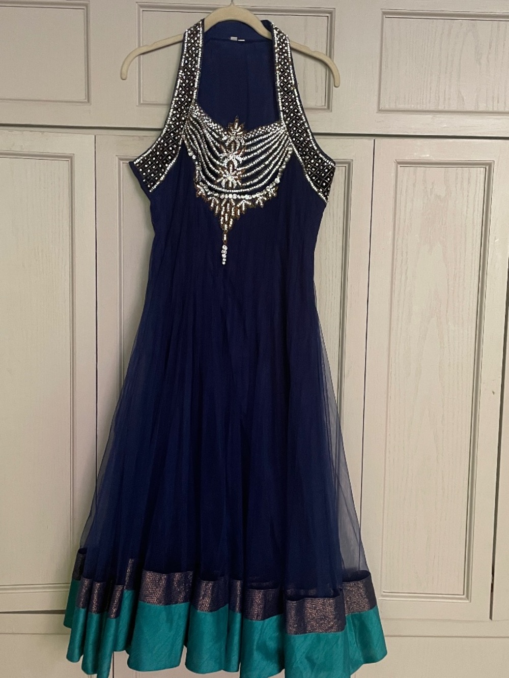 Deep blue maxi gown with embroidered rhinestones.